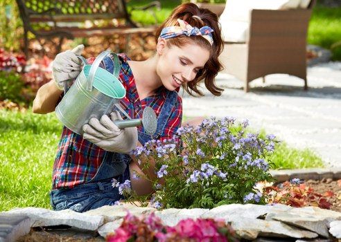 Gardener preparing hedge trimming equipment before starting work
